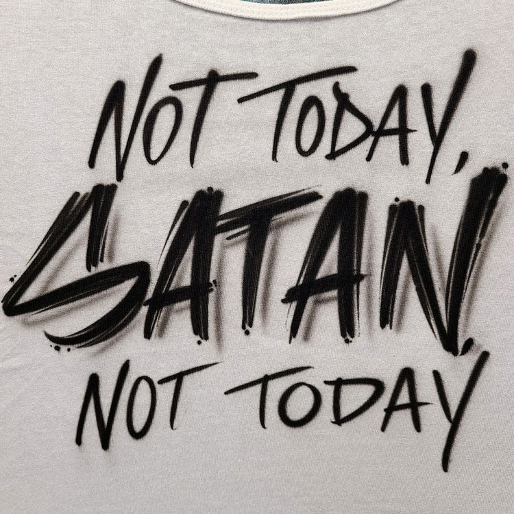 White tank top with black airbrush graffiti-style lettering that reads “Not Today, Satan, Not Today” in bold, hand-painted script.