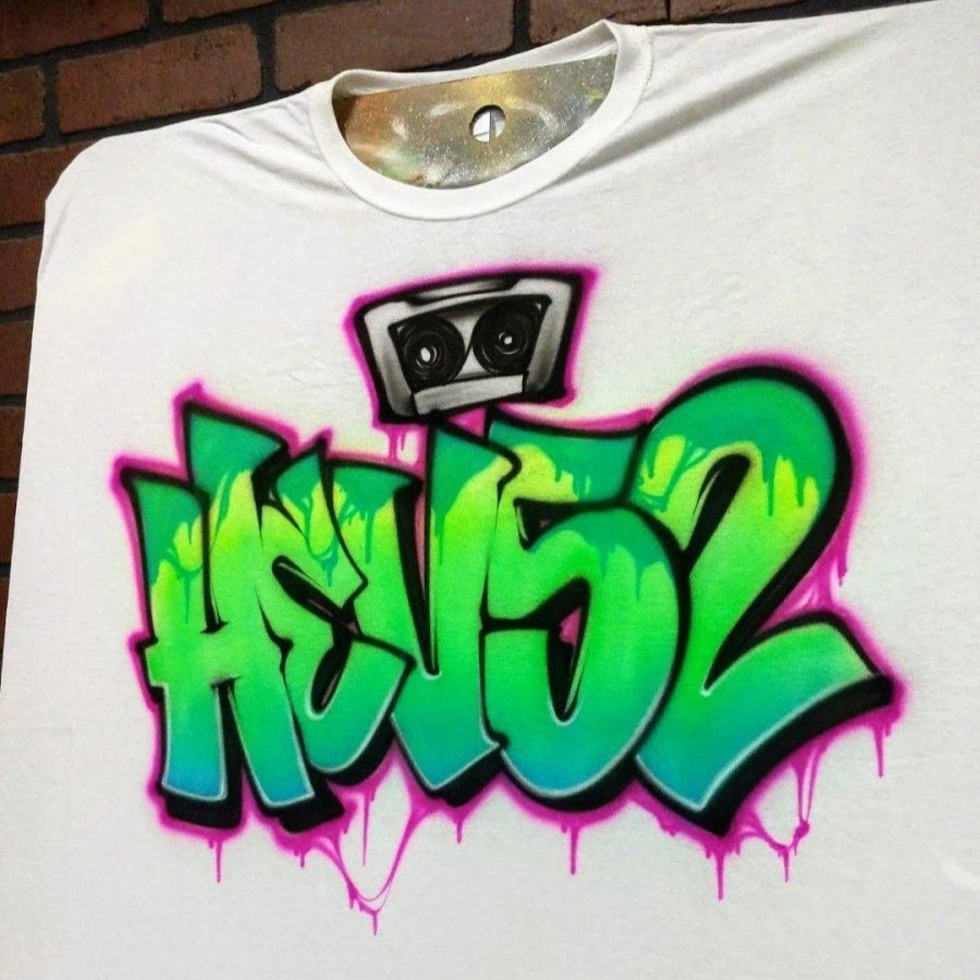 side view of a custom Ggaffiti shirt featuring a cassette tape and wildstyle street art lettering