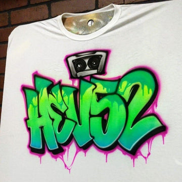 side view of a custom Ggaffiti shirt featuring a cassette tape and wildstyle street art lettering