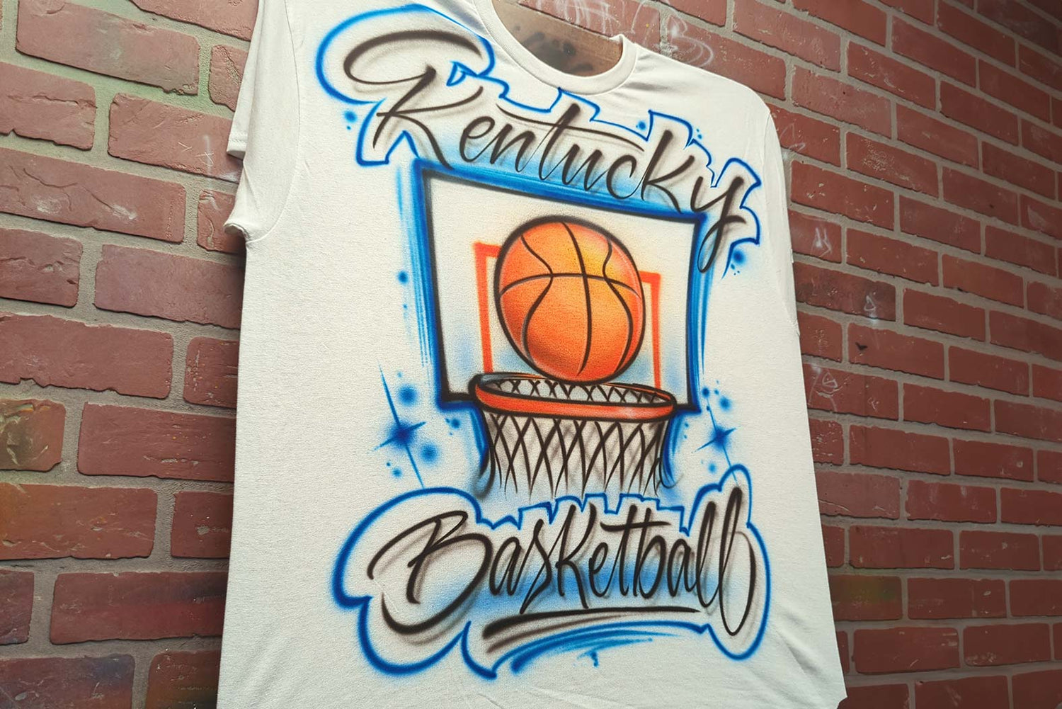 Airbrushed basketball design on a t shirt with a personalized team name